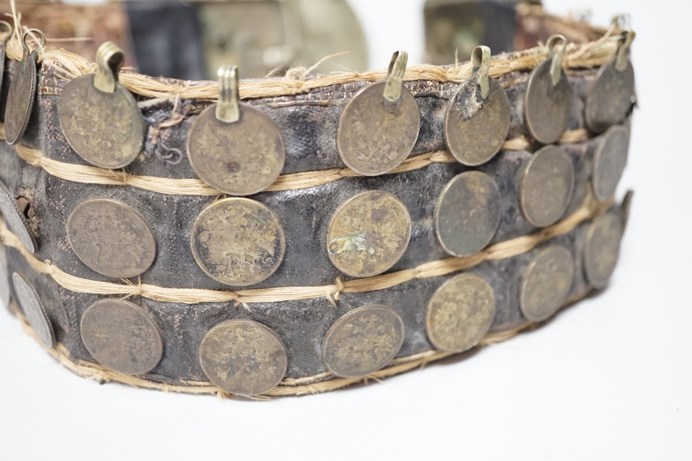 A 19th century Afghan belt, Russian coin mounted